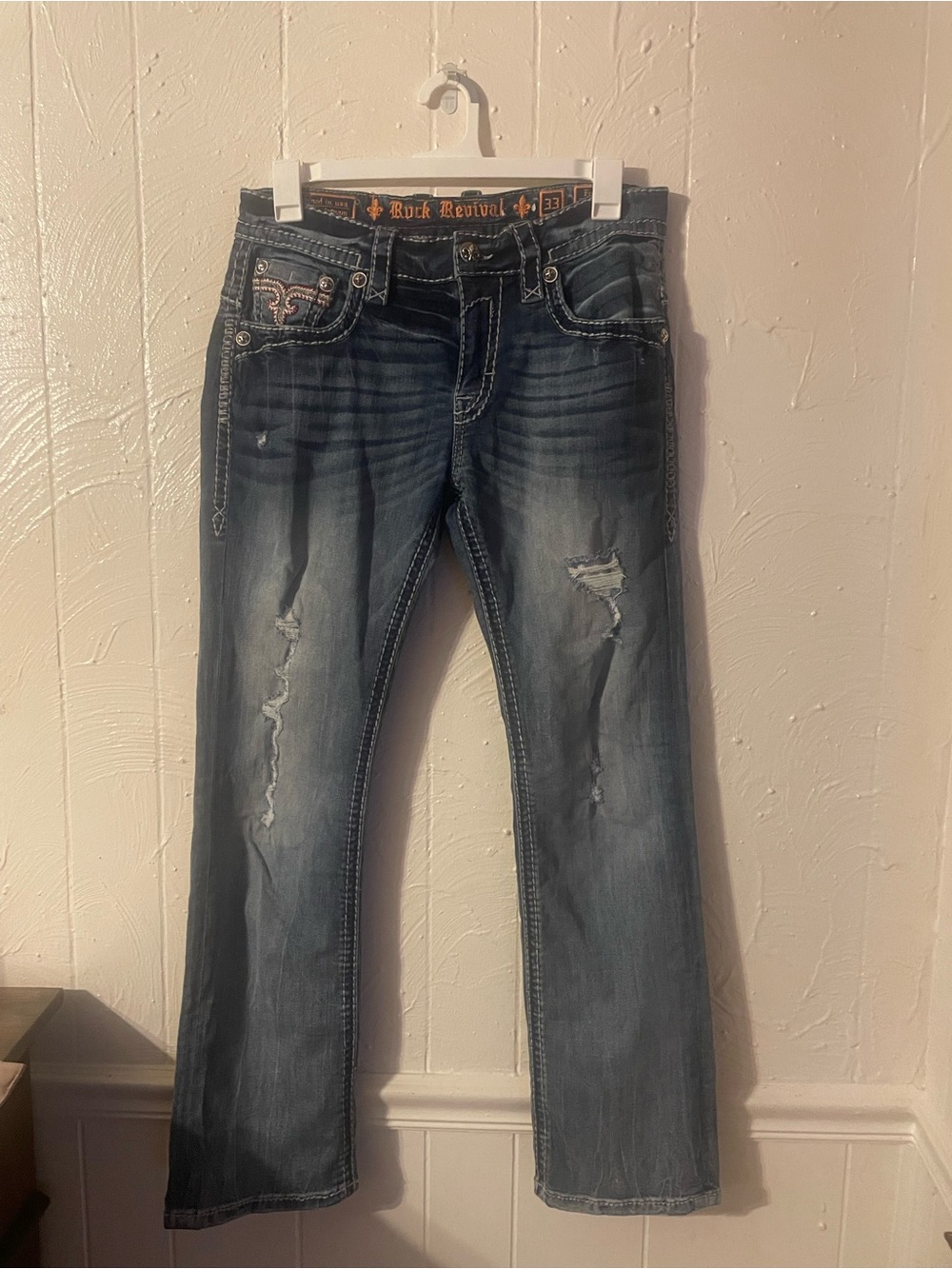 Rock Revival Bootcut Jeans in Washed Blue with Distressed Details